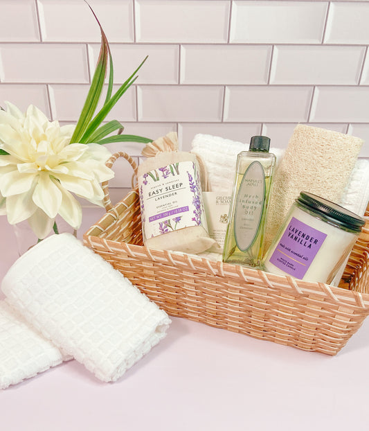 Spa bathroom accessories for half bathroom. Interior decor items like matching hand towels, and wash cloths, basket with candles, soaps and oils, artificial plants. Interior design, Mini model kit.